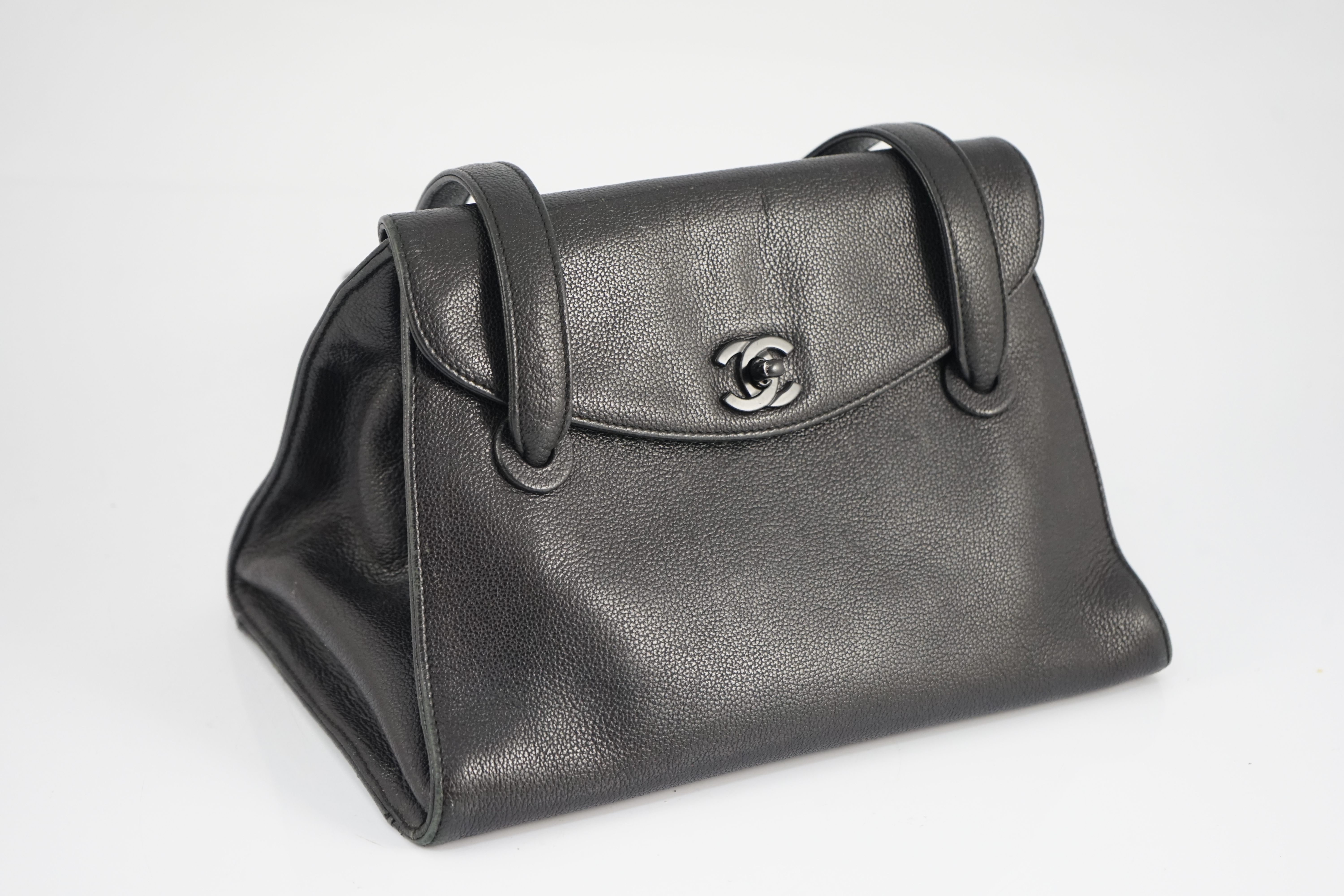 A black Chanel CC shoulder bag width 28cm, depth 17.5cm, length 19cm
